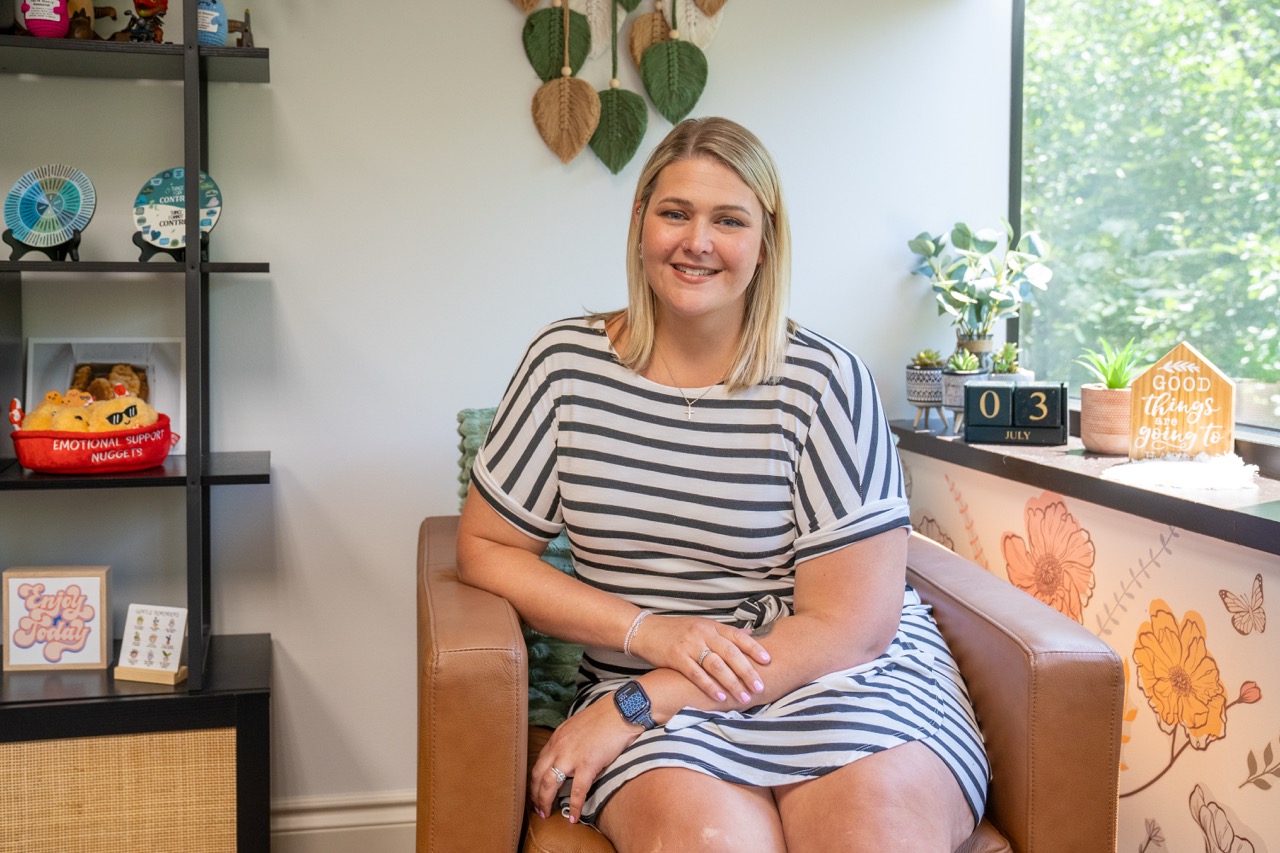 A smiling therapist in a comfortable office setting at our mental health and substance use treatment center