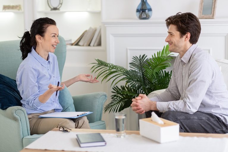 Man talking with a therapist during an Accelerated Resolution Therapy session at River's Bend.